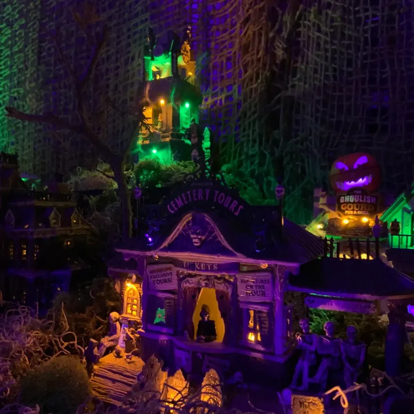 SpookyTown illuminated in purple and green