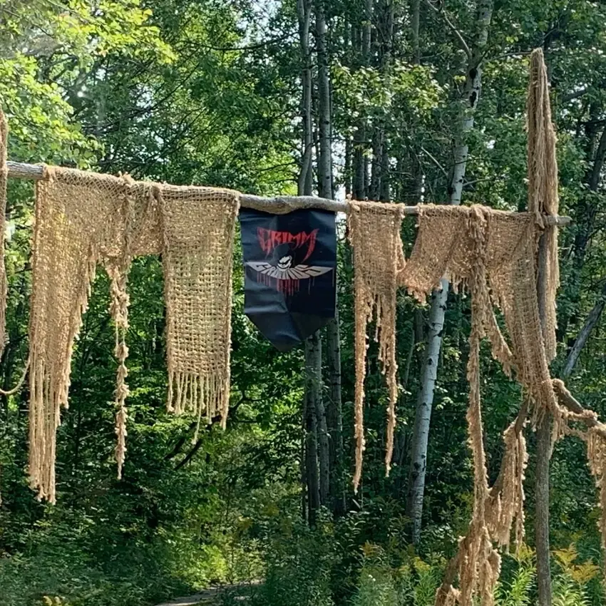 Tattered fabric hanging along the Wendigo Trail during daytime